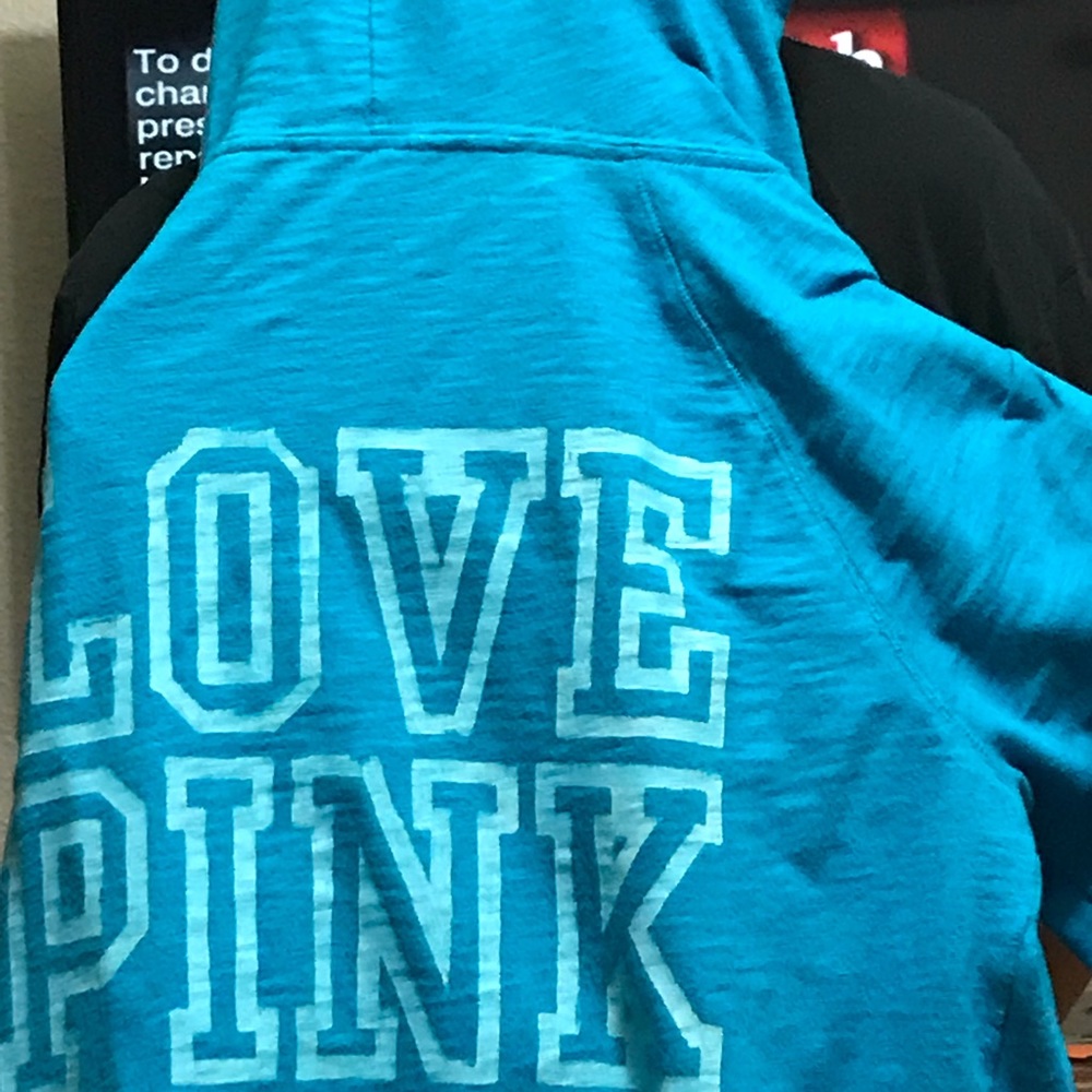 Victoria Principal pink sweatshirt.